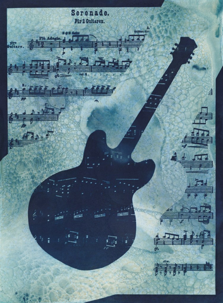 Double exposure cyanotype print of a guitar with sheet music. Commission piece by Jill Welham