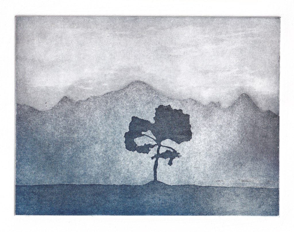Original aquatint etching by Jill Welham. The print was inspired by a landscape in the Scottish Highlands and shows a single tree in the foreground with high mountains in the background. Printed in blue and purple ink. Landscape intaglio etching, Limited edition print.